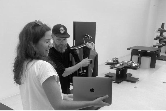 Reviewing product with a laptop in the showroom